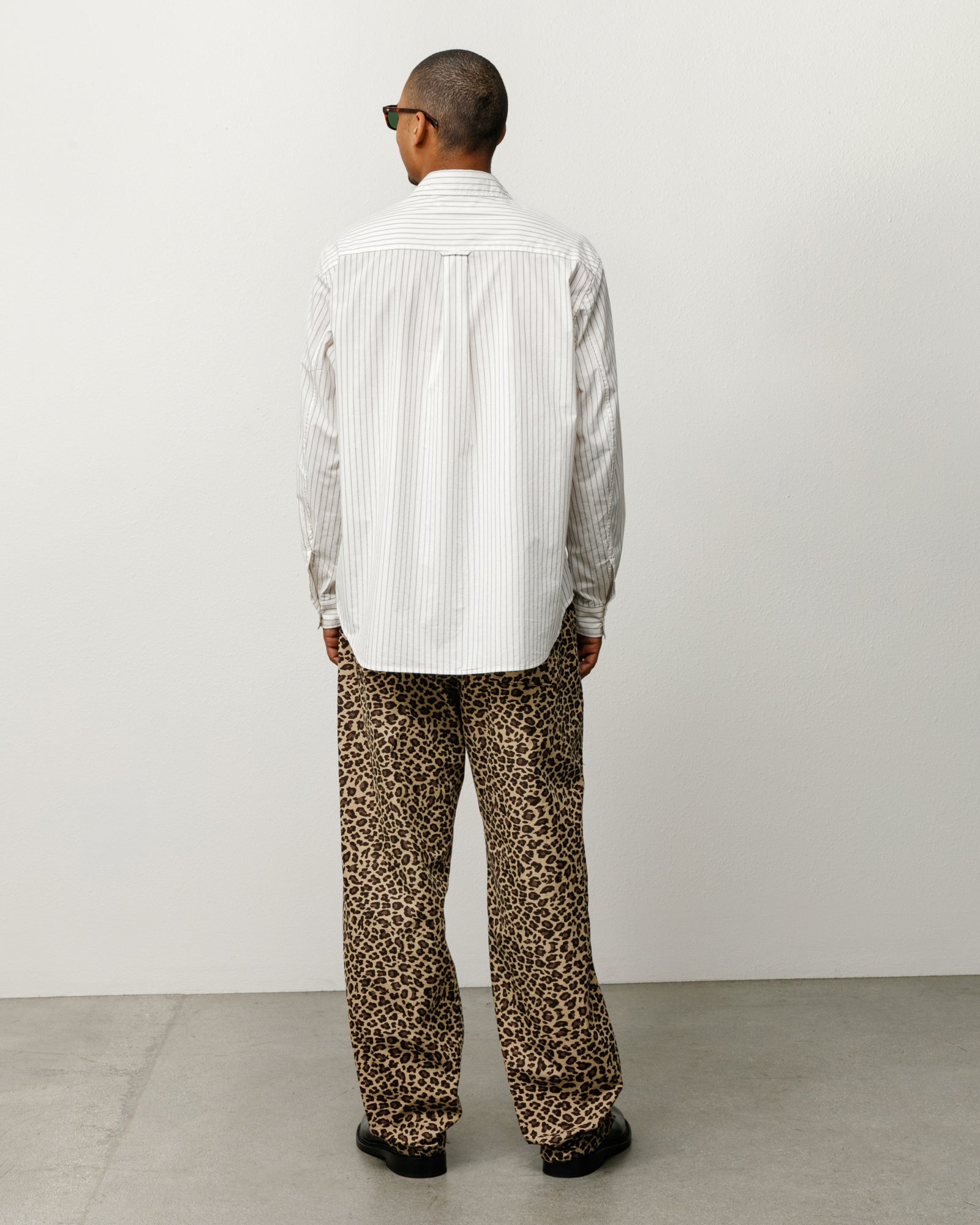 Natural stripe long-sleeve button-up shirt, back view on model.