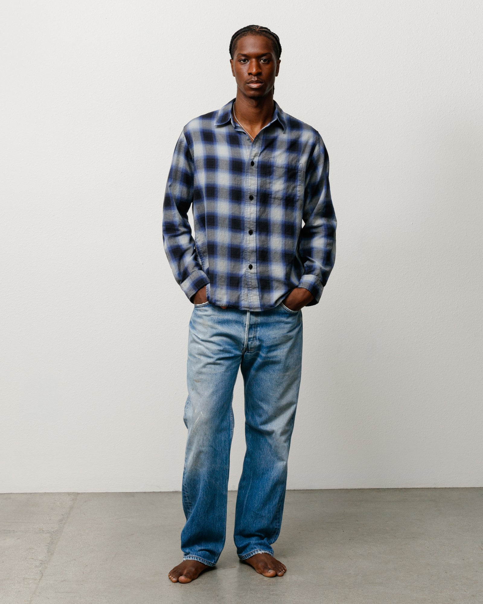 Unisex long sleeve Beach Ombre plaid shirt in black.