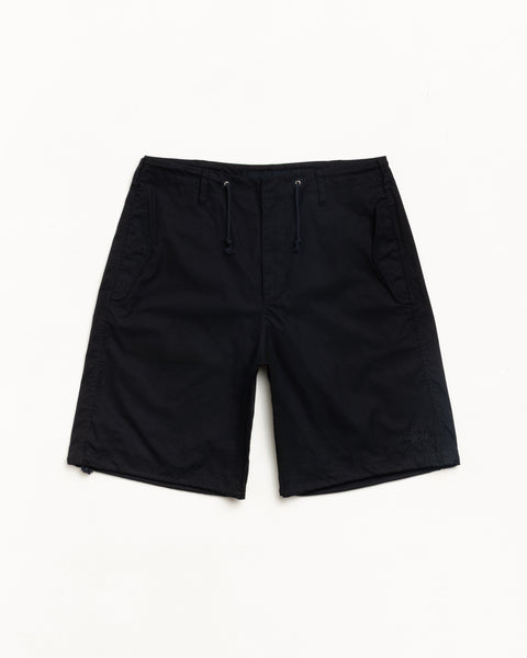 Black unisex baggy shorts with drawcord waist, side pockets and subtle logo at hem