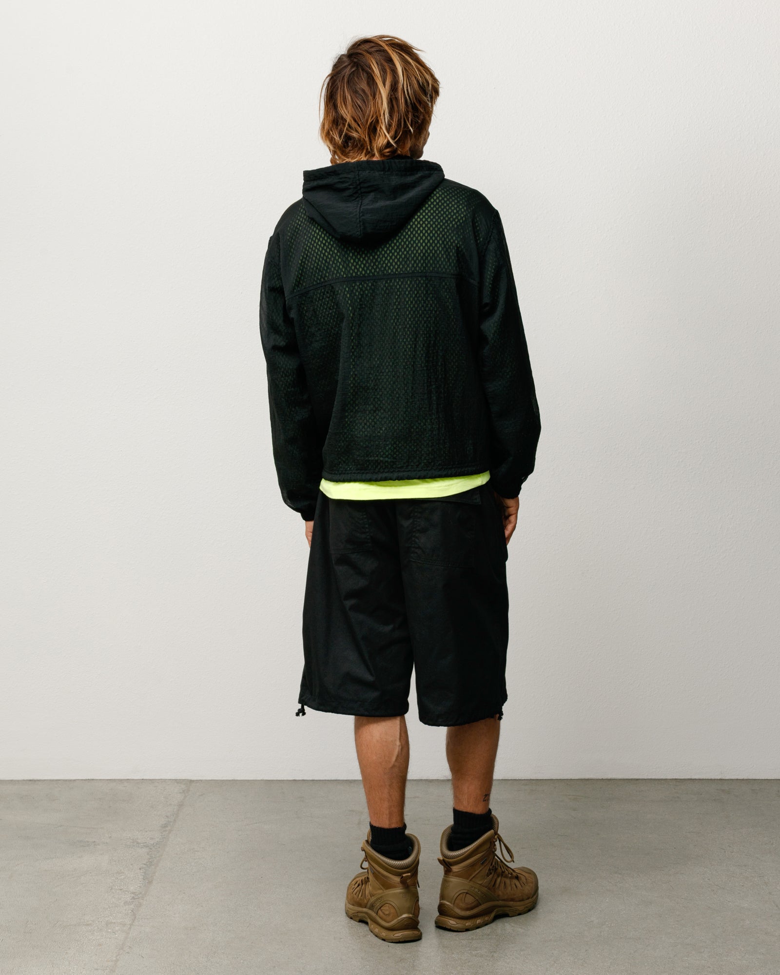 Surplus Short unisex regular in black, back view on model, knee-length with adjustable hem drawcords