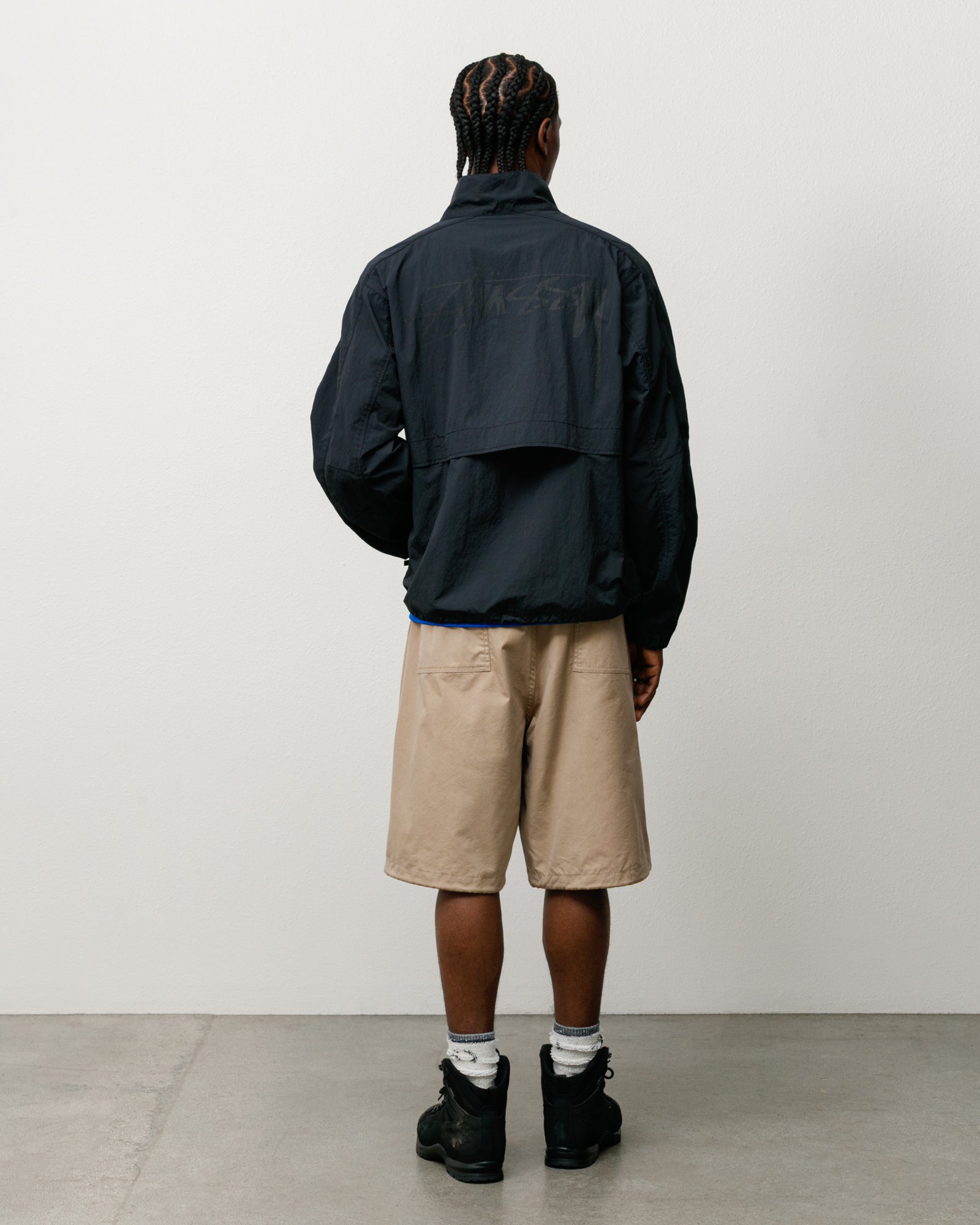 Khaki Surplus Short, unisex regular fit, shown on a model from the back