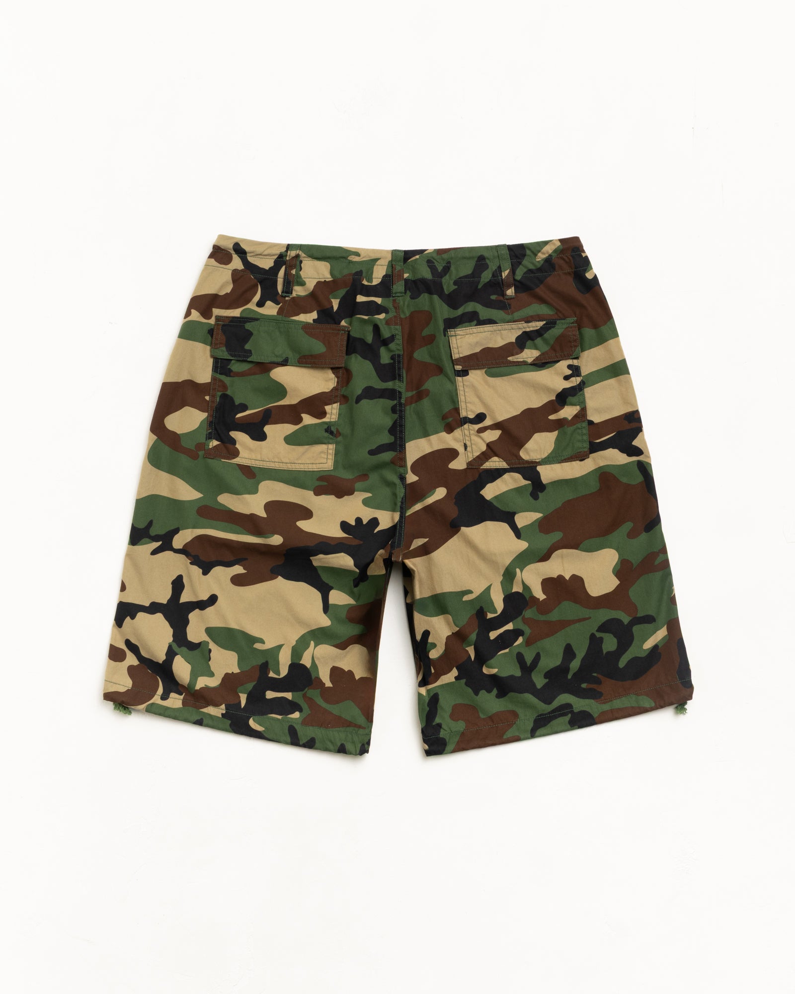 Woodland camo shorts, back view with two patch pockets and relaxed knee-length cut.