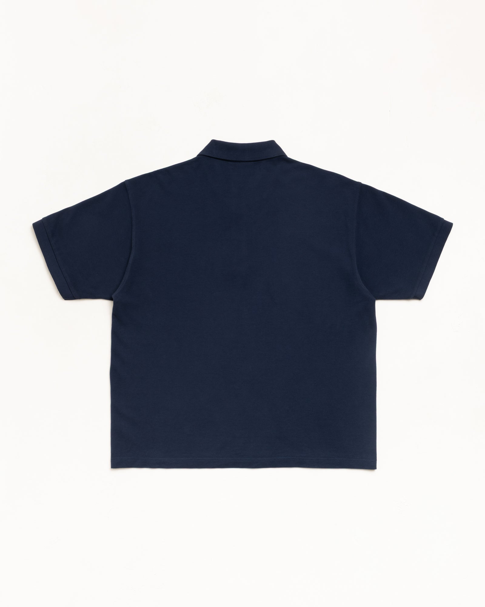 Classic Pique Polo Unisex Short Sleeve In Navy Cotton, Back View Flat Lay