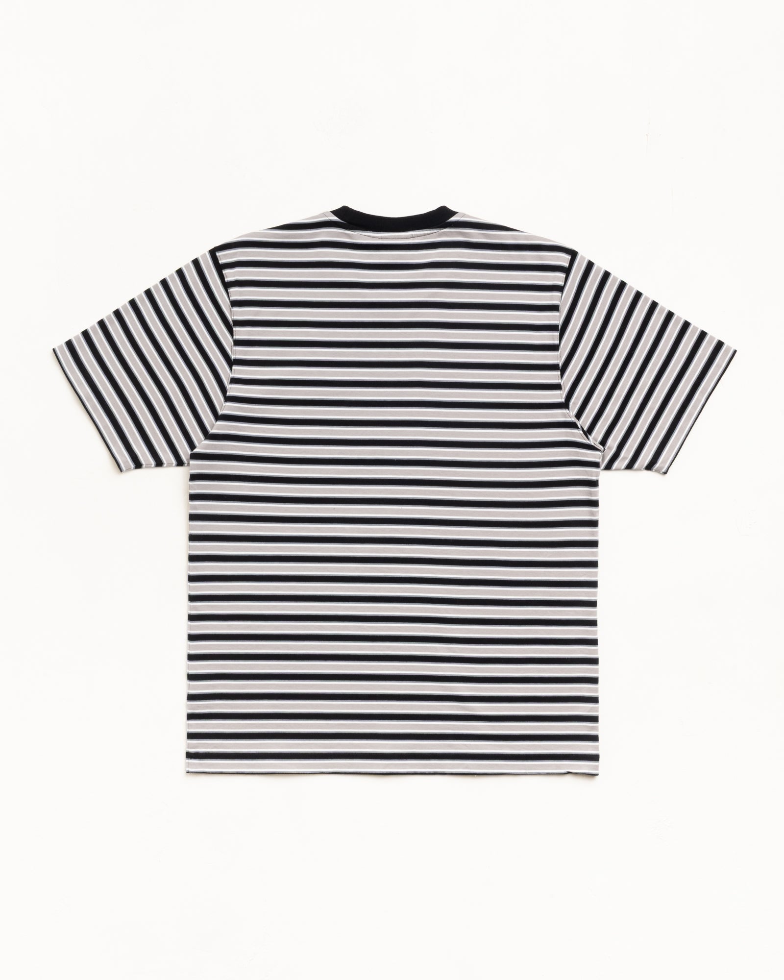 Back view of black short-sleeve tee with black-and-white stripes and a ribbed crewneck.