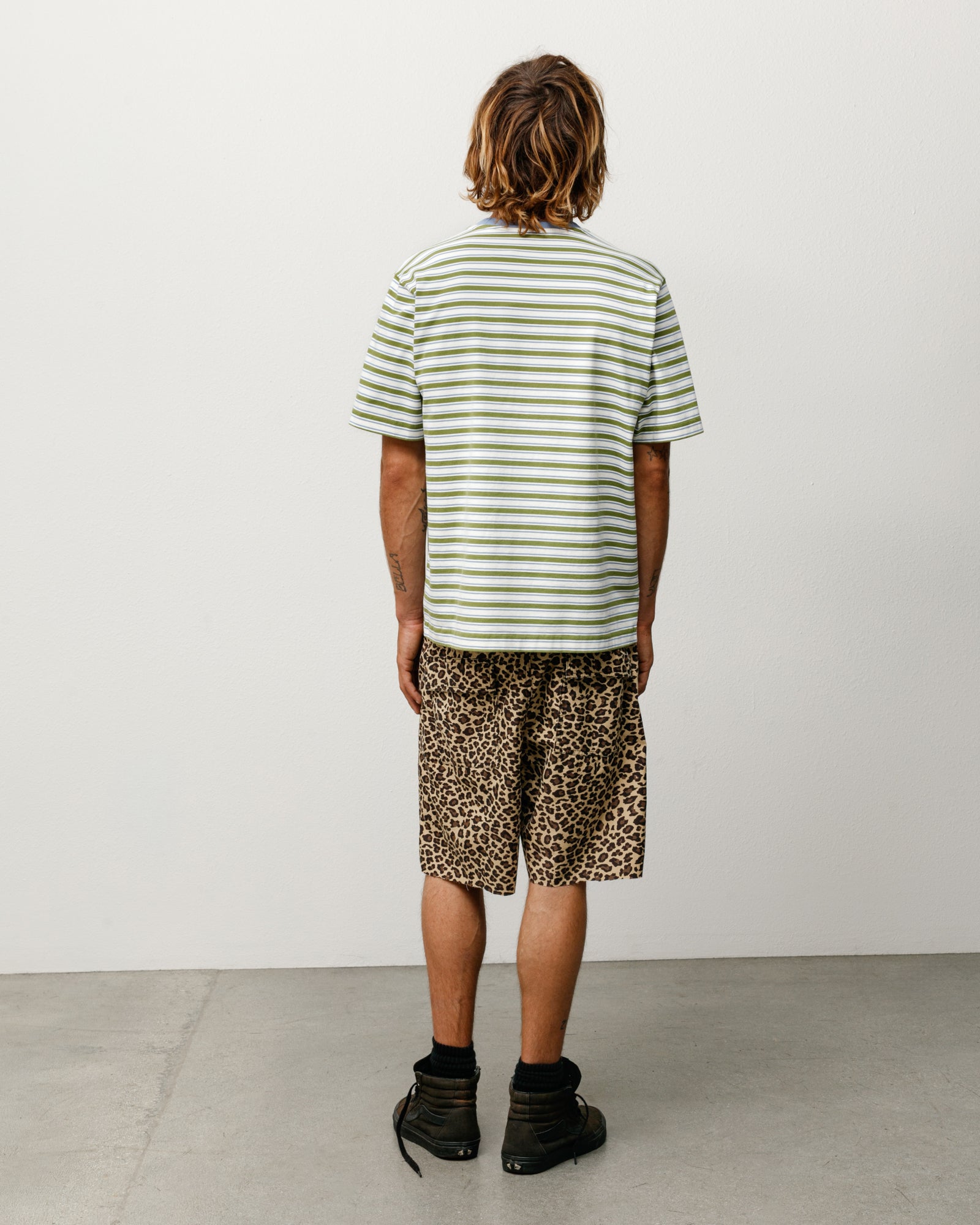 Moss green striped short-sleeve tee in relaxed cotton jersey, back view on model