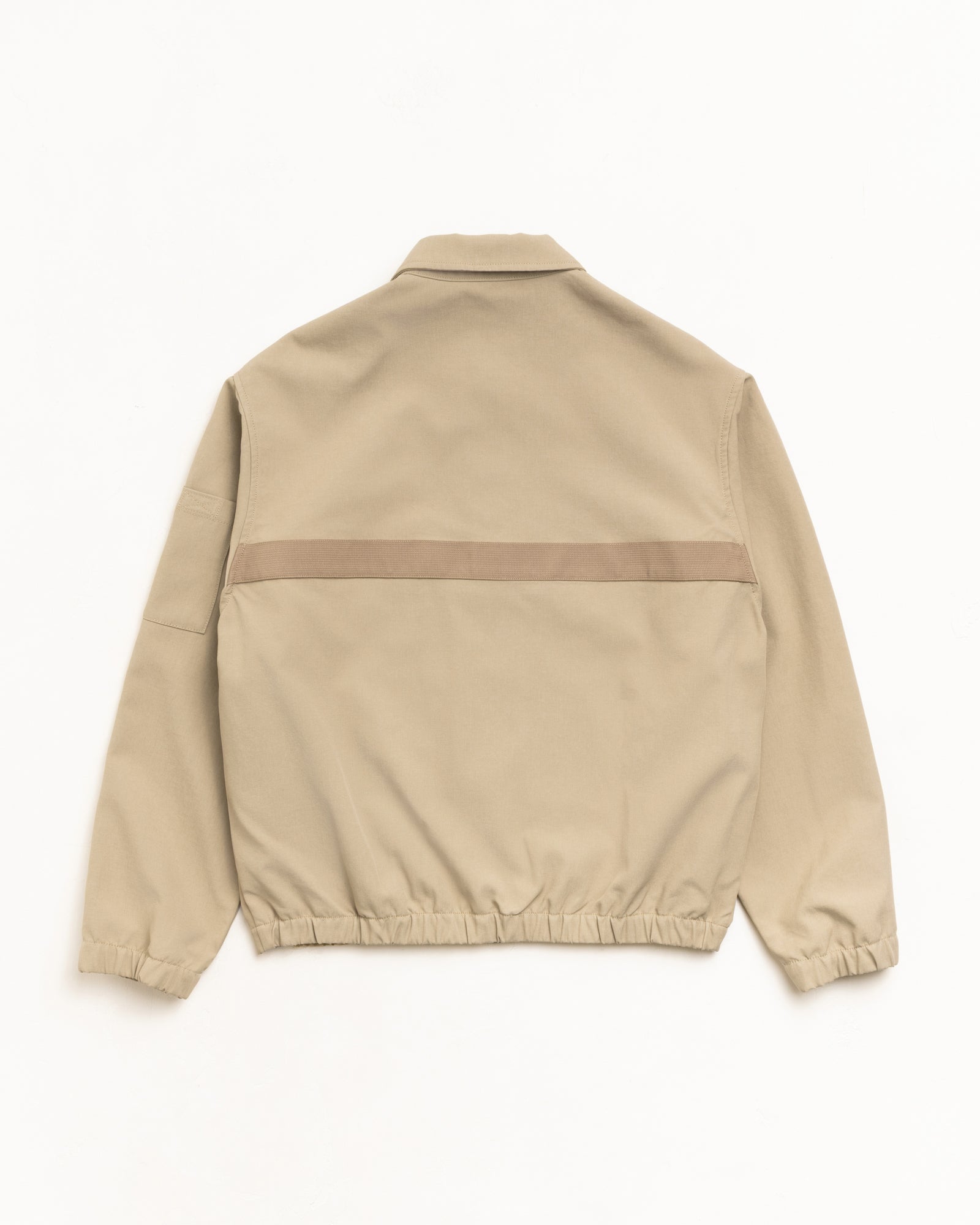 Mechanic jacket in khaki, back view with tonal webbing strip and elastic hem