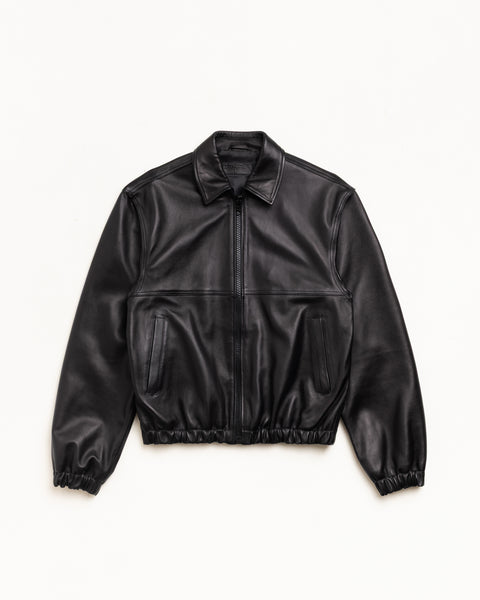 Black leather zip-front work jacket with welt pockets and elastic hem, unisex long sleeve