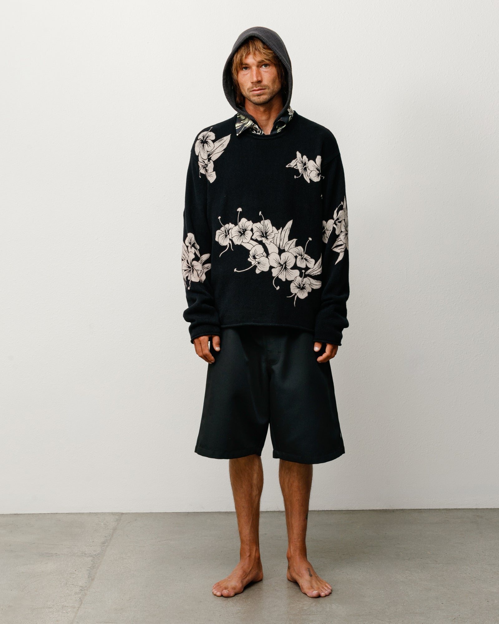 Black roll neck sweater with allover floral knit, relaxed unisex long sleeves
