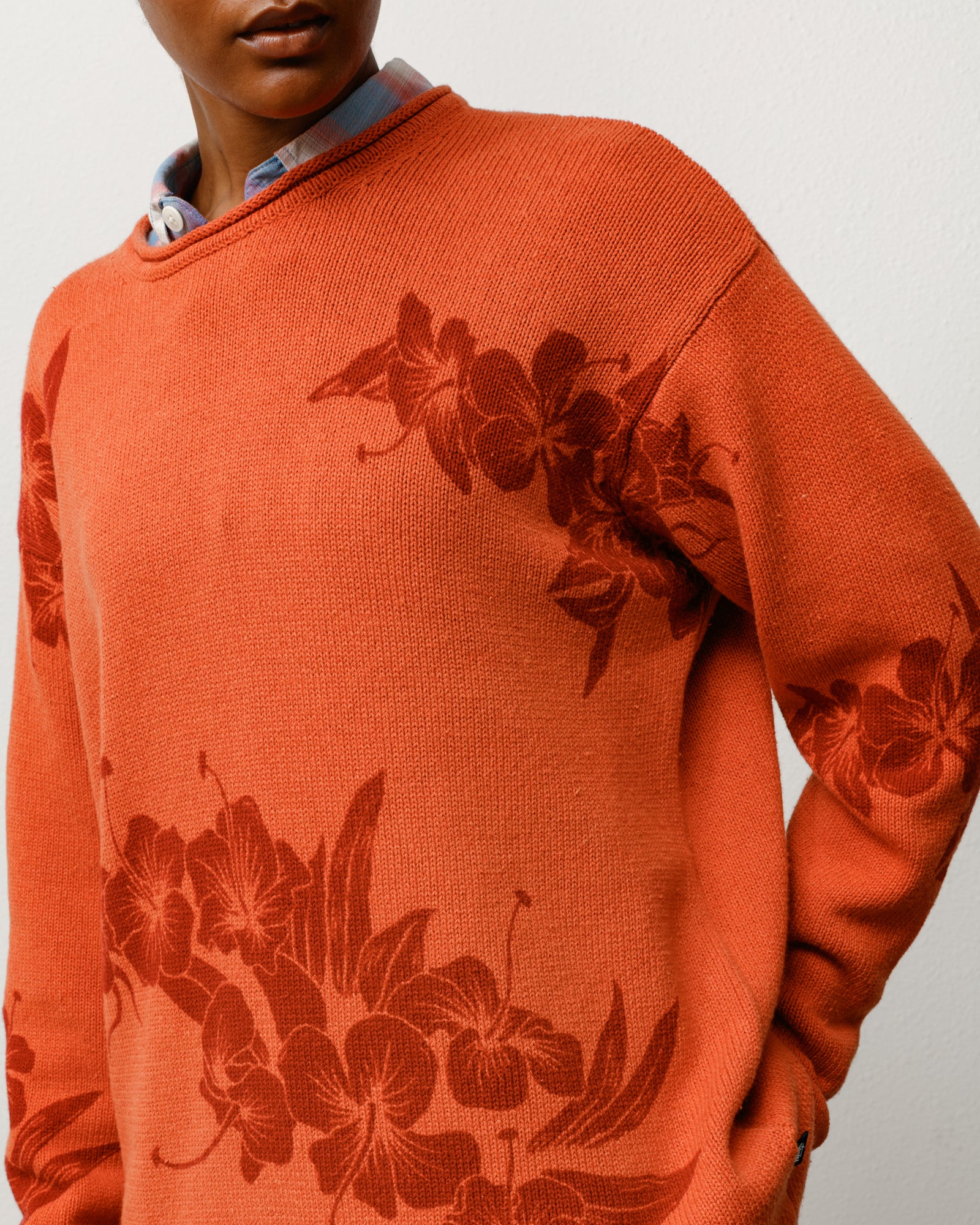 Rust floral roll neck sweater with tonal floral knit and rolled crewneck, on-model close-up