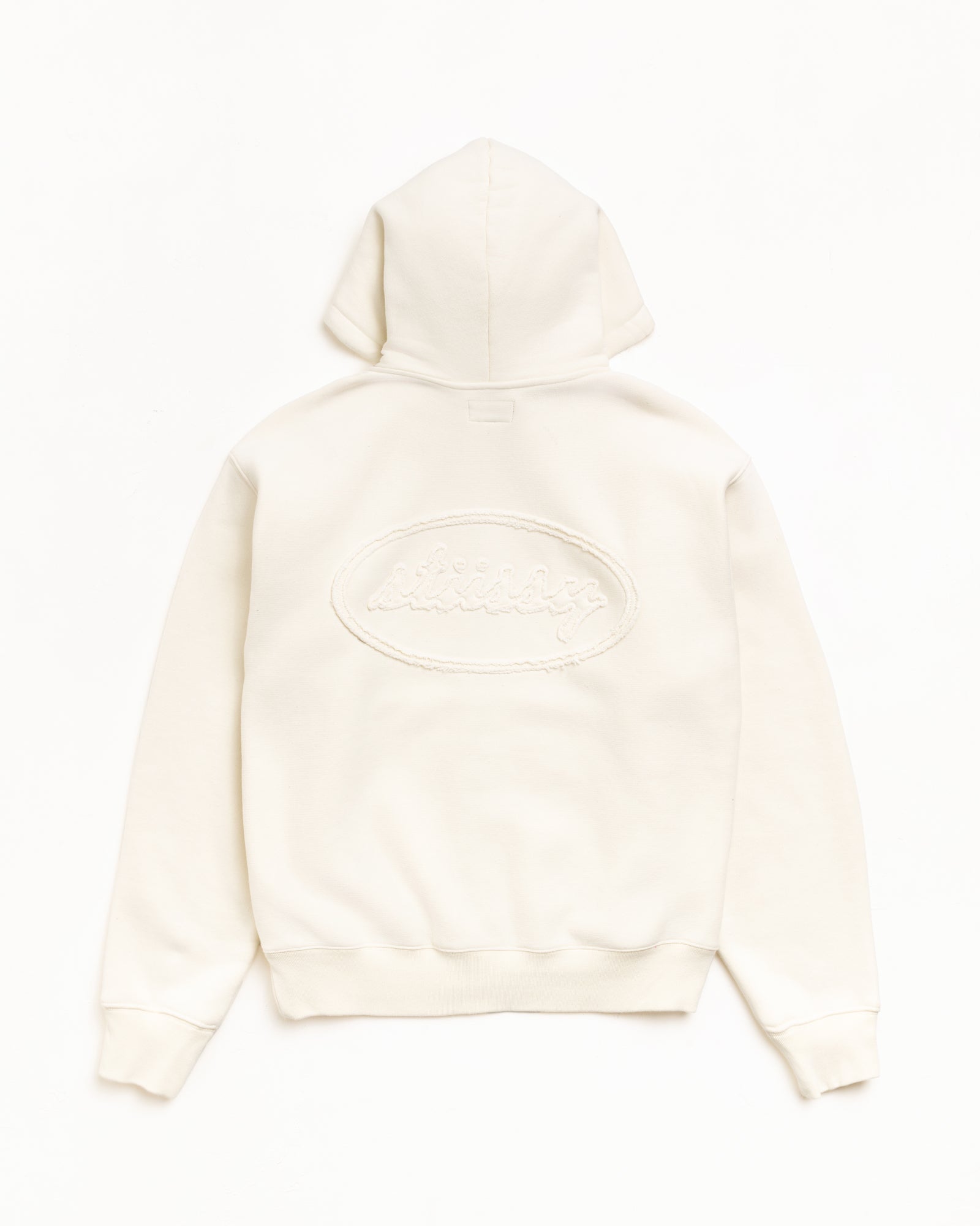 Natural zip hoodie, back view with tonal cursive applique logo