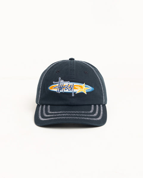 Black six-panel cap with contrast zig-zag stitching and oval star logo embroidery