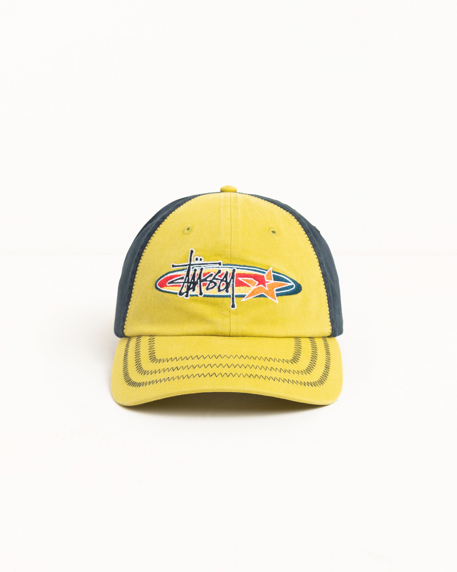 Front view of lime cotton twill cap with oval-star logo embroidery and zig-zag stitched brim