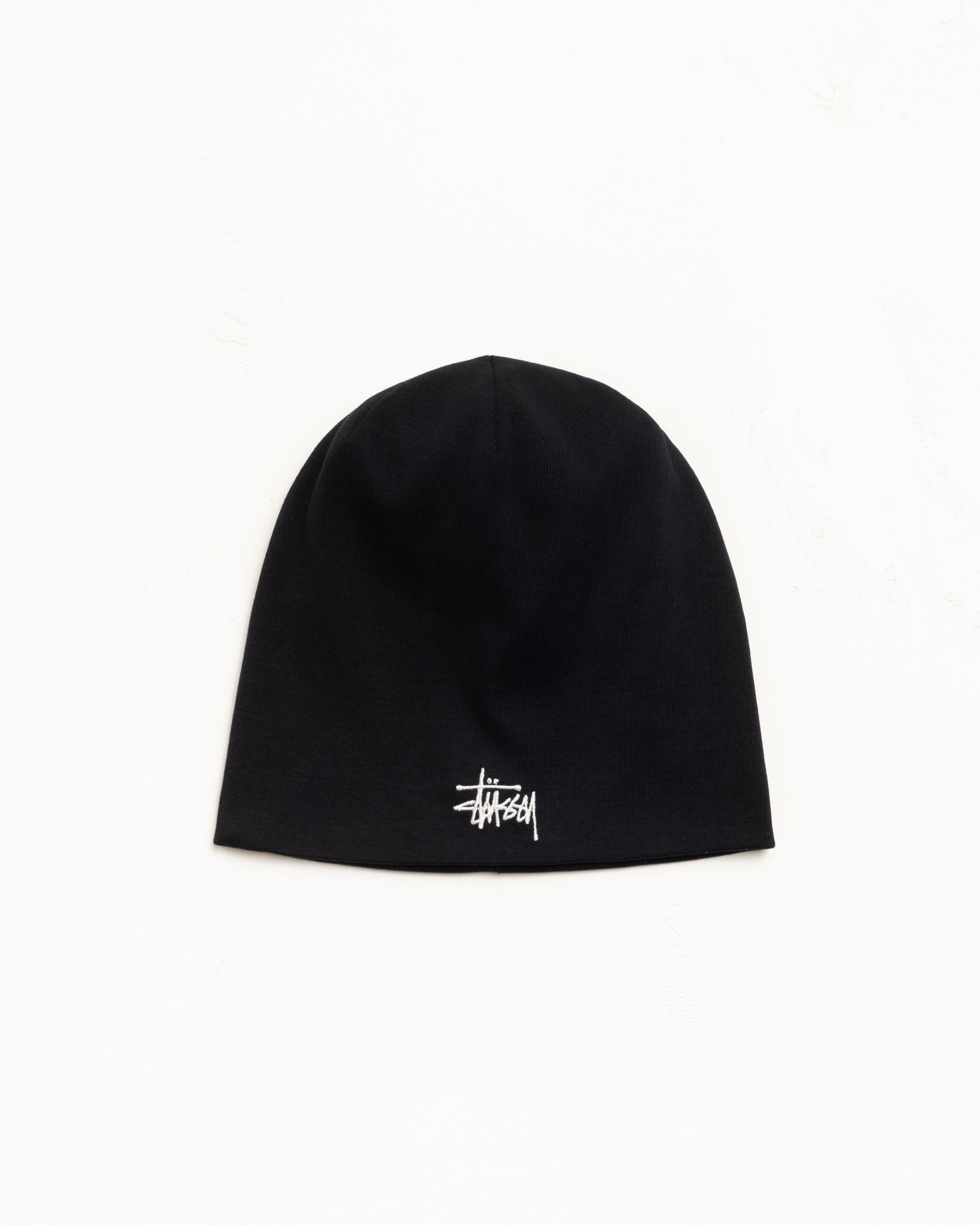 Black jersey skullcap beanie with white embroidered logo, unisex fit