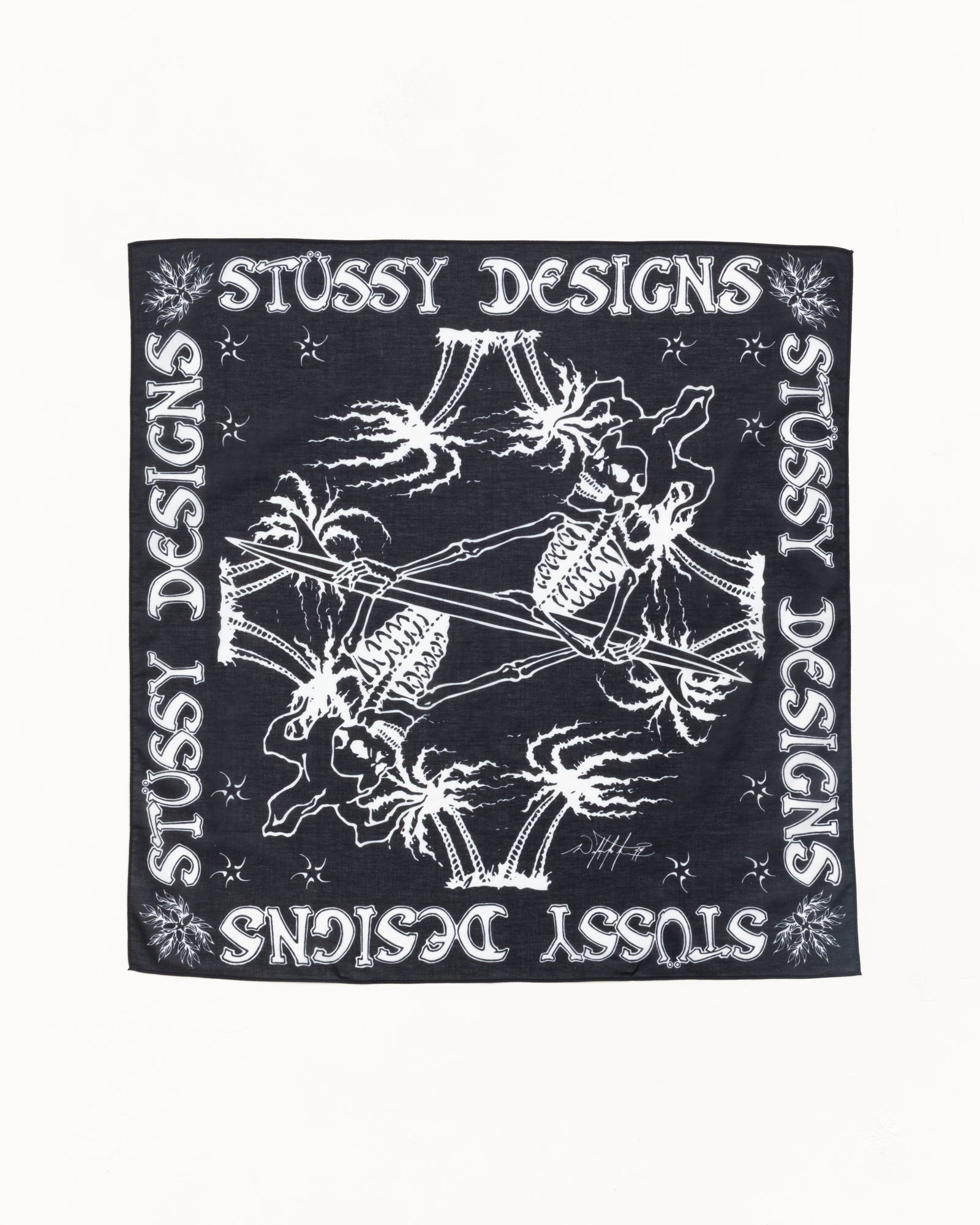 Black bandana with white skeleton surfer artwork and Stüssy Designs border