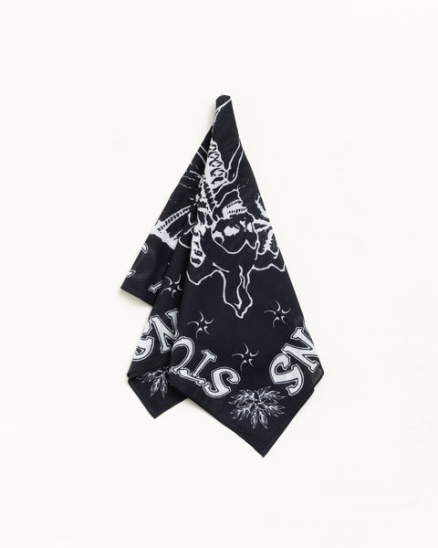 Black cotton bandana with white graphic print, square and draped against a white background