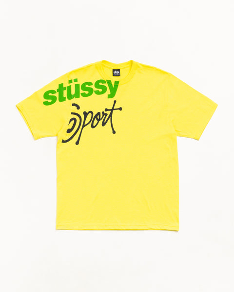 Lemon yellow unisex short-sleeve cotton tee with bold green Stüssy Sport graphic across chest