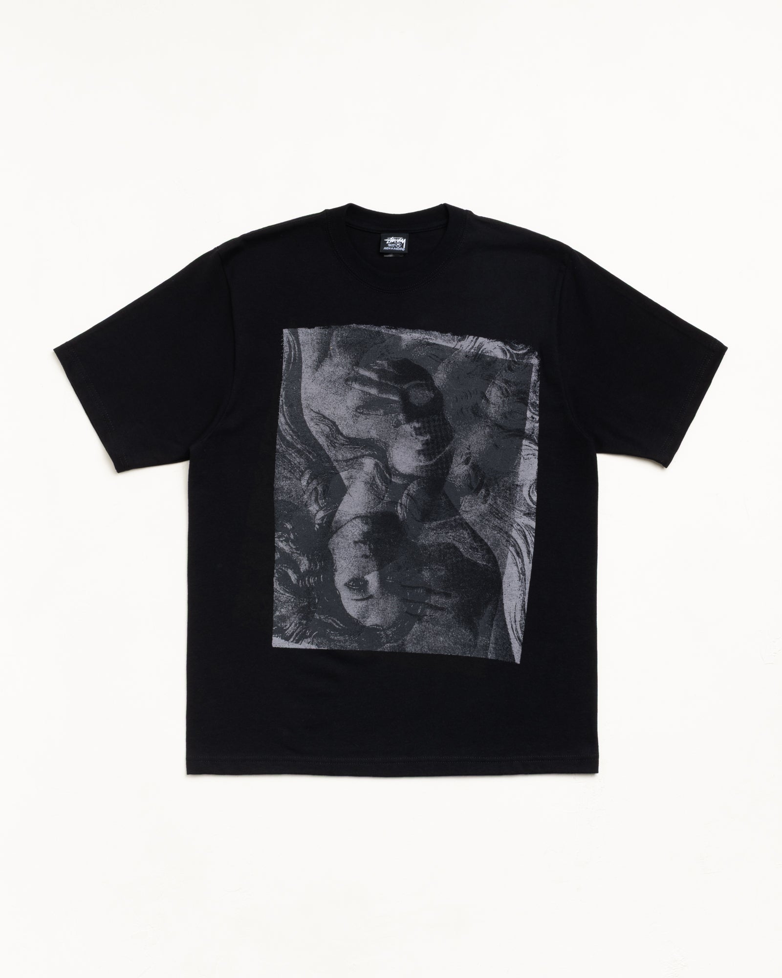 Black unisex short-sleeve tee with large greyscale graphic print on front