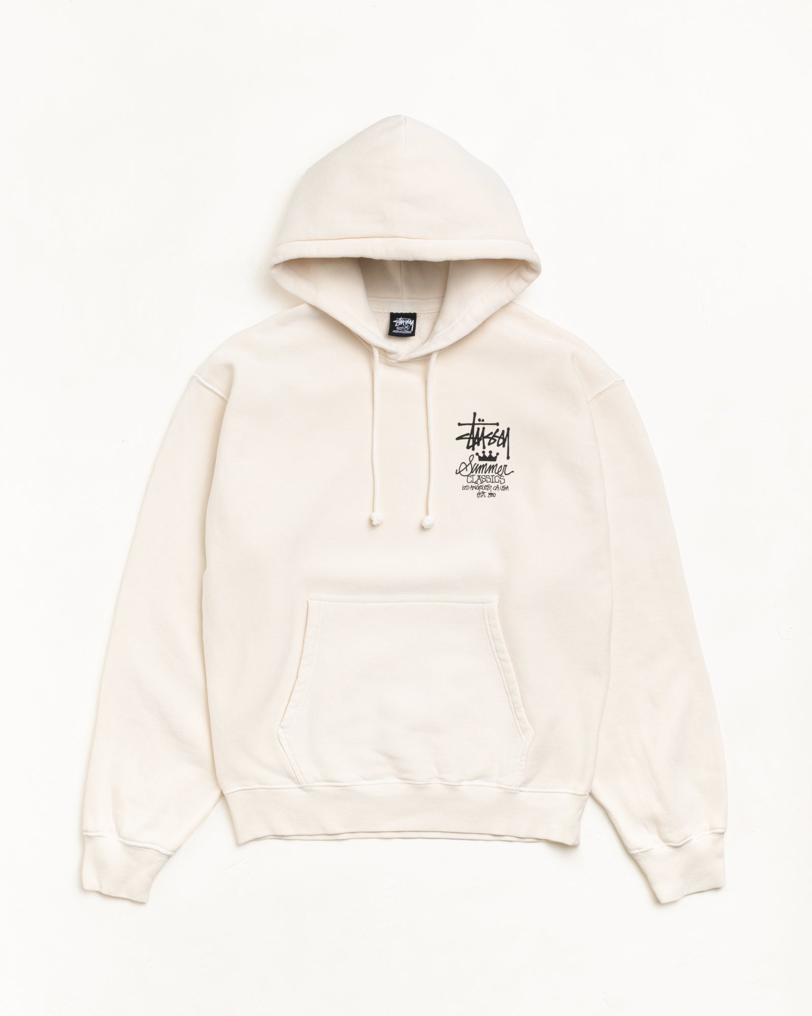 Bone-colour pullover hoodie with drawcord hood, left-chest logo graphic, and kangaroo pocket