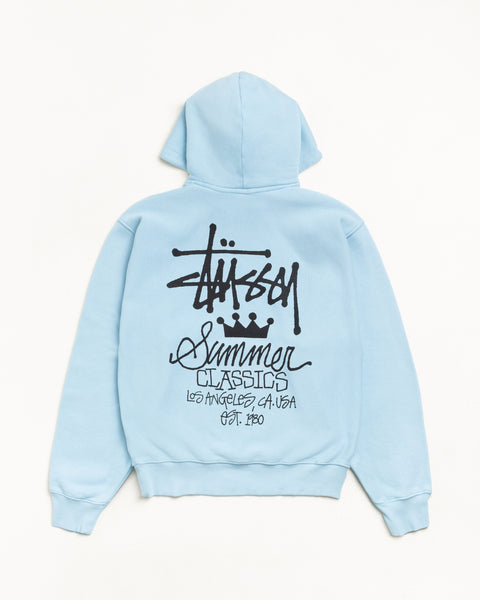 Sky blue garment-dyed hoodie, back view with bold black graphic and ribbed hem