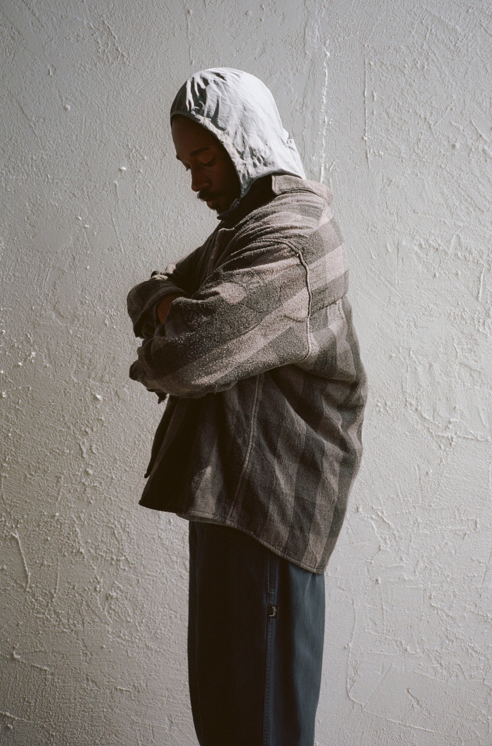 Model wearing the Our Legacy Borrowed Jacket  in Overdyed from Stussy & Our Legacy Vol. 10. 